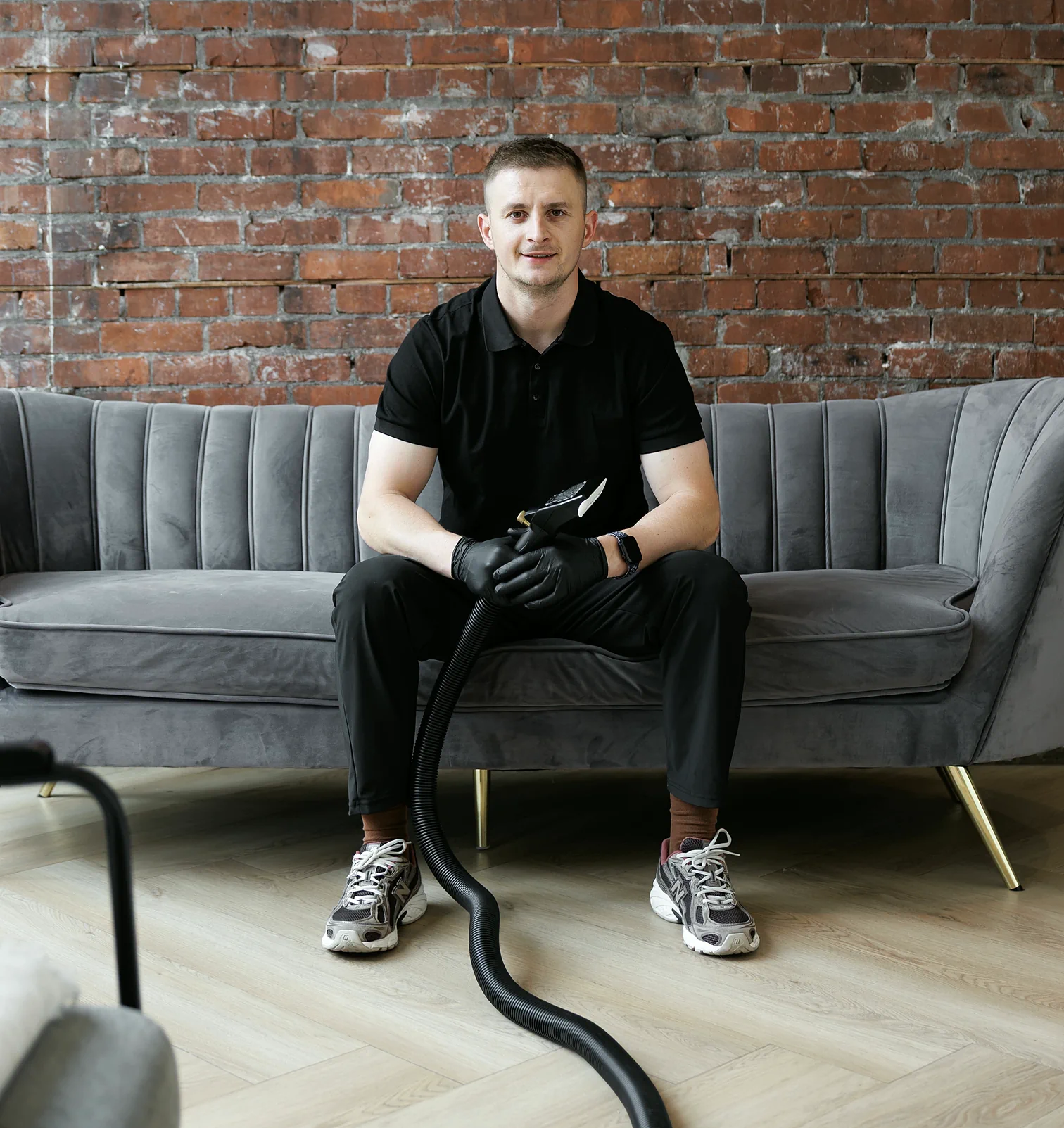 Andrew, owner of C&M Cleaning Services, with his upholstery cleaning tool