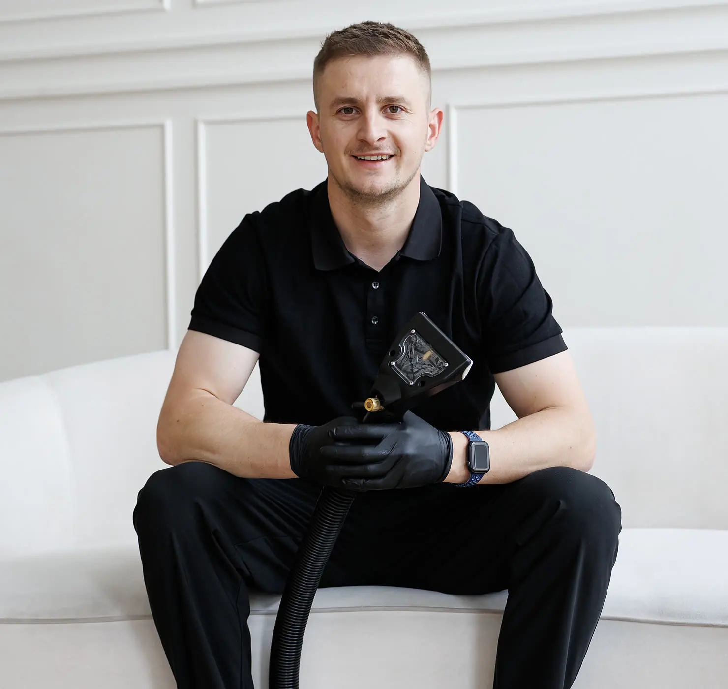 Andrew, owner of C&M Cleaning Services, with his upholstery cleaning tool
